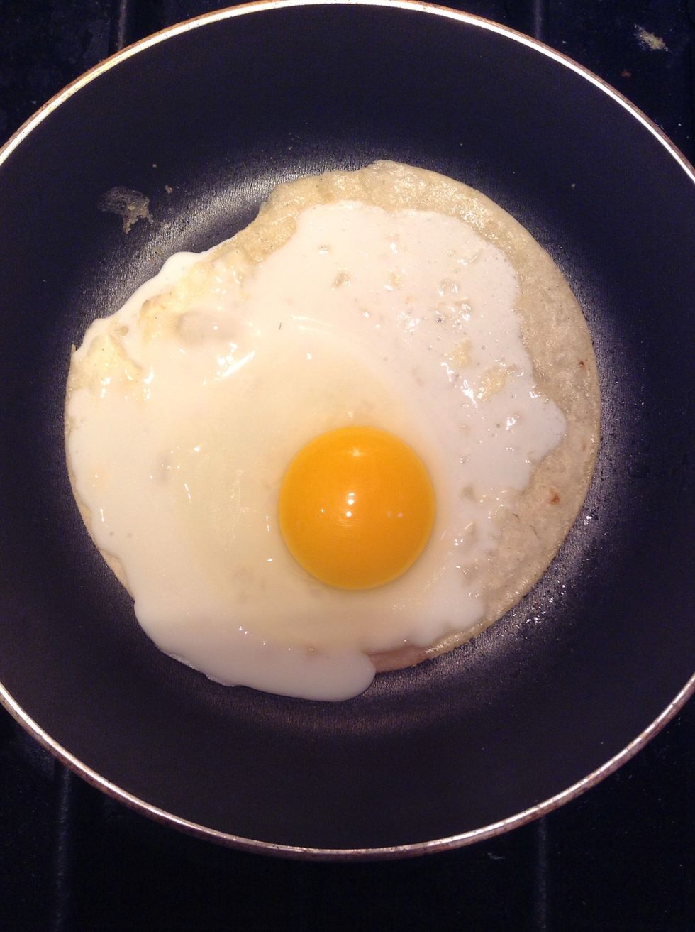 The egg should be about halfway cooked like this.