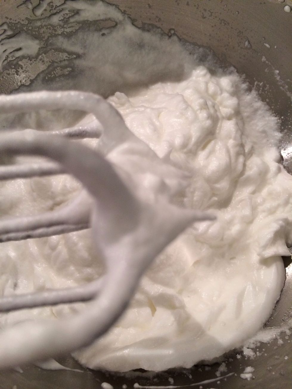 The egg whites are in stiff peaks. Carefully, Fold in the chocolate mix in 3 steps. Fill the ramekins to the top. At this stage you can keep them in the fridge for 2-3 hrs.