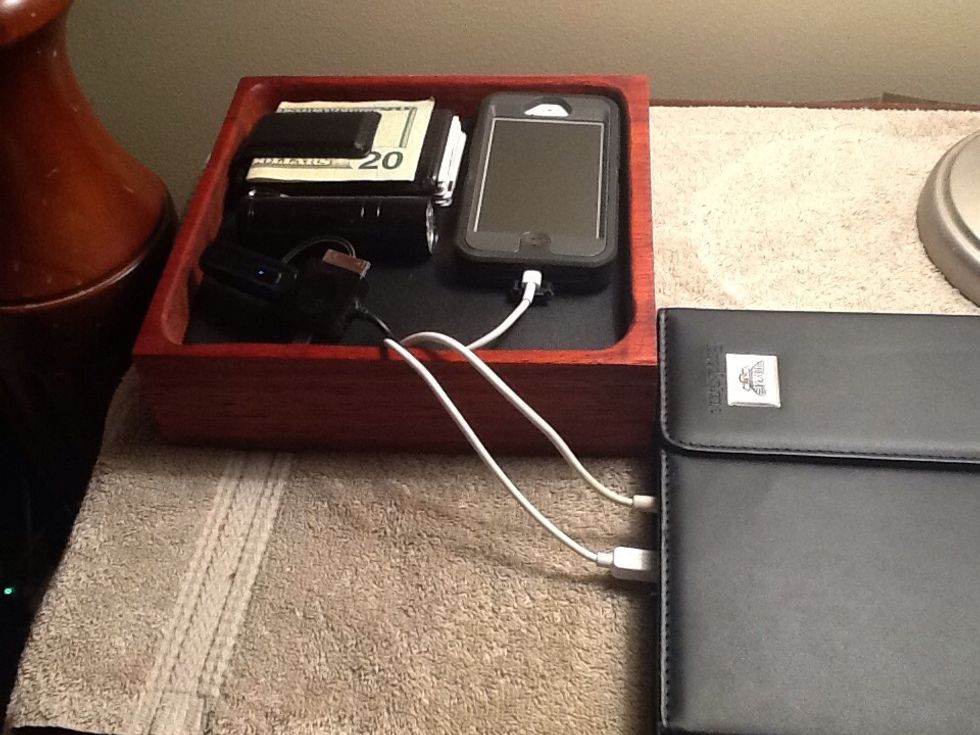 The electronic valet chargers all my devices, holds my wallet and a small flashlight.