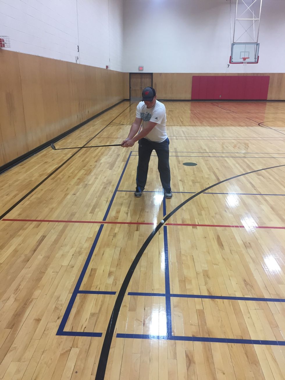 The end of the grip should point towards your target