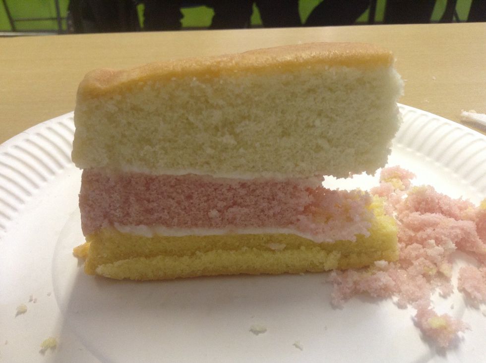 The erosion of the pink slice makes the white area above overhang