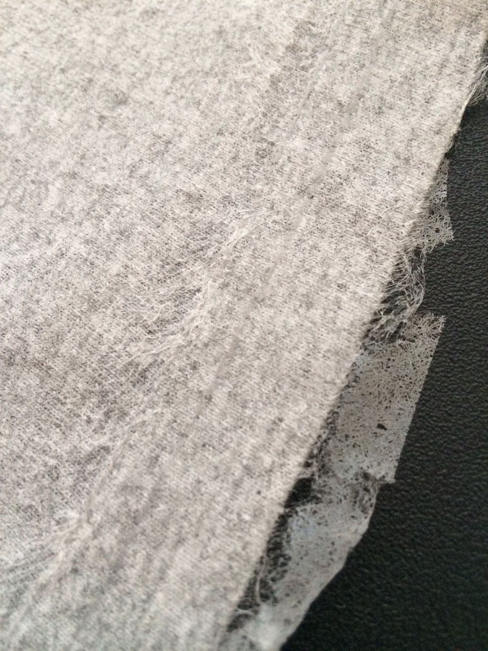 The extra at the edges can now be trimmed off before ironing your belly onto the shirt.