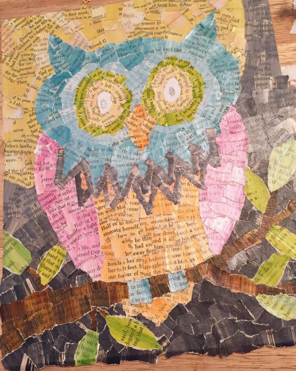 the face and eyes are almost finished and another set of triangle shapes was added and defined. all that's left it to tear out ovals from black for centers of eyes.