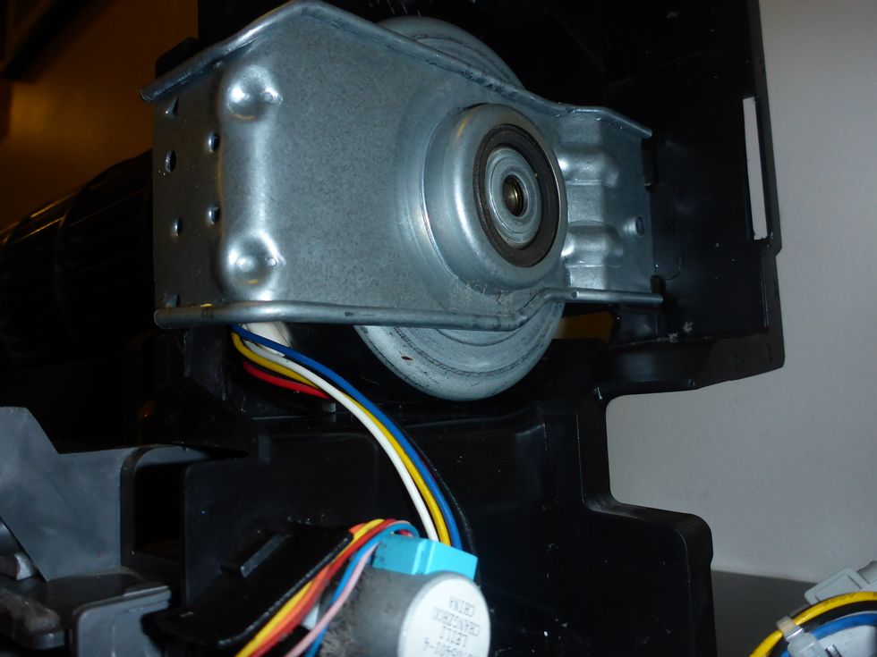 The fan motor should look like this. I've seen cases where the motor and it's connector has been rotated clockwise, which causes the motor axle to be slightly tilted (will lead to failure).