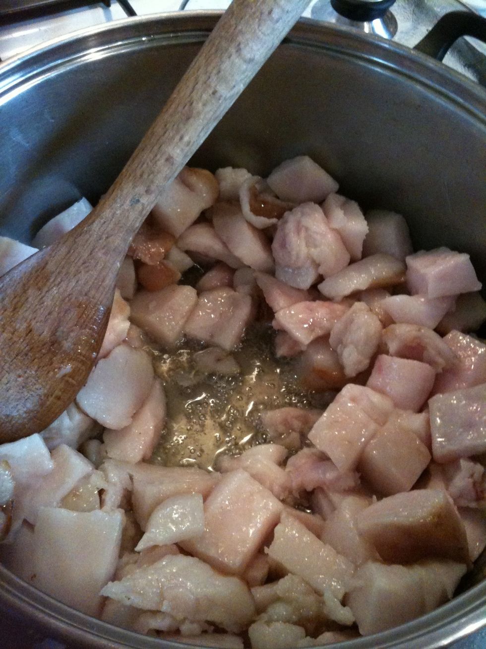 The fat will begin to brown as it renders.