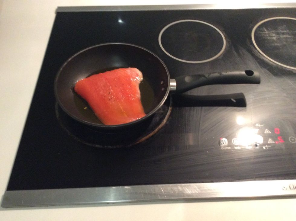 The fifth step is to place the salmon in a pan, then cook on medium heat for 4 to 5 minutes