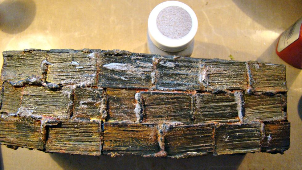 The final is adding some more texture with Concrete Stone Effects. Swipe ontop of the grout . Repeat this same process for the outside of the coffin lid.