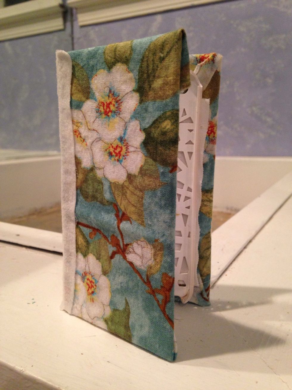 The final product! Its flexibility is amazing, so it can serve as it's own iPhone stand too.