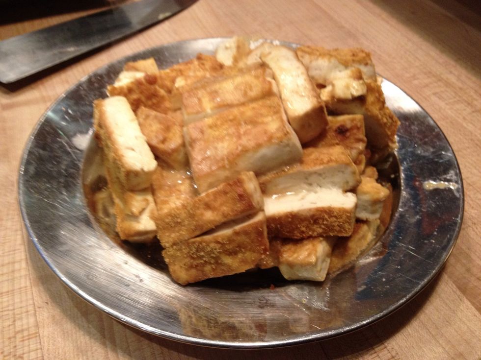 The finish product: Kathryn's Awesome Tofu usually gets served with rice and vegetables. It is also great in sandwiches or cold the next day for a snack. Serves 4-6 people.