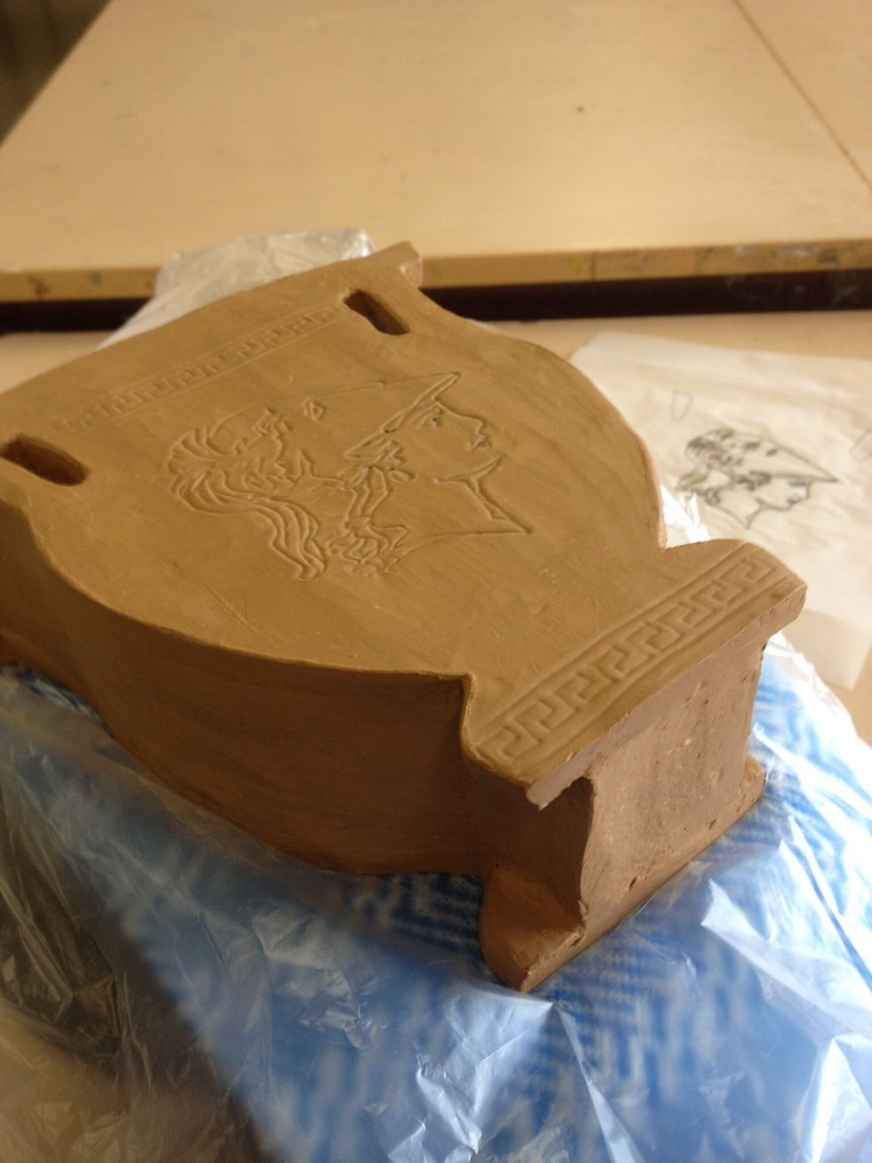 The finished design should be copied to both sides. Pictured ready to underglaze.