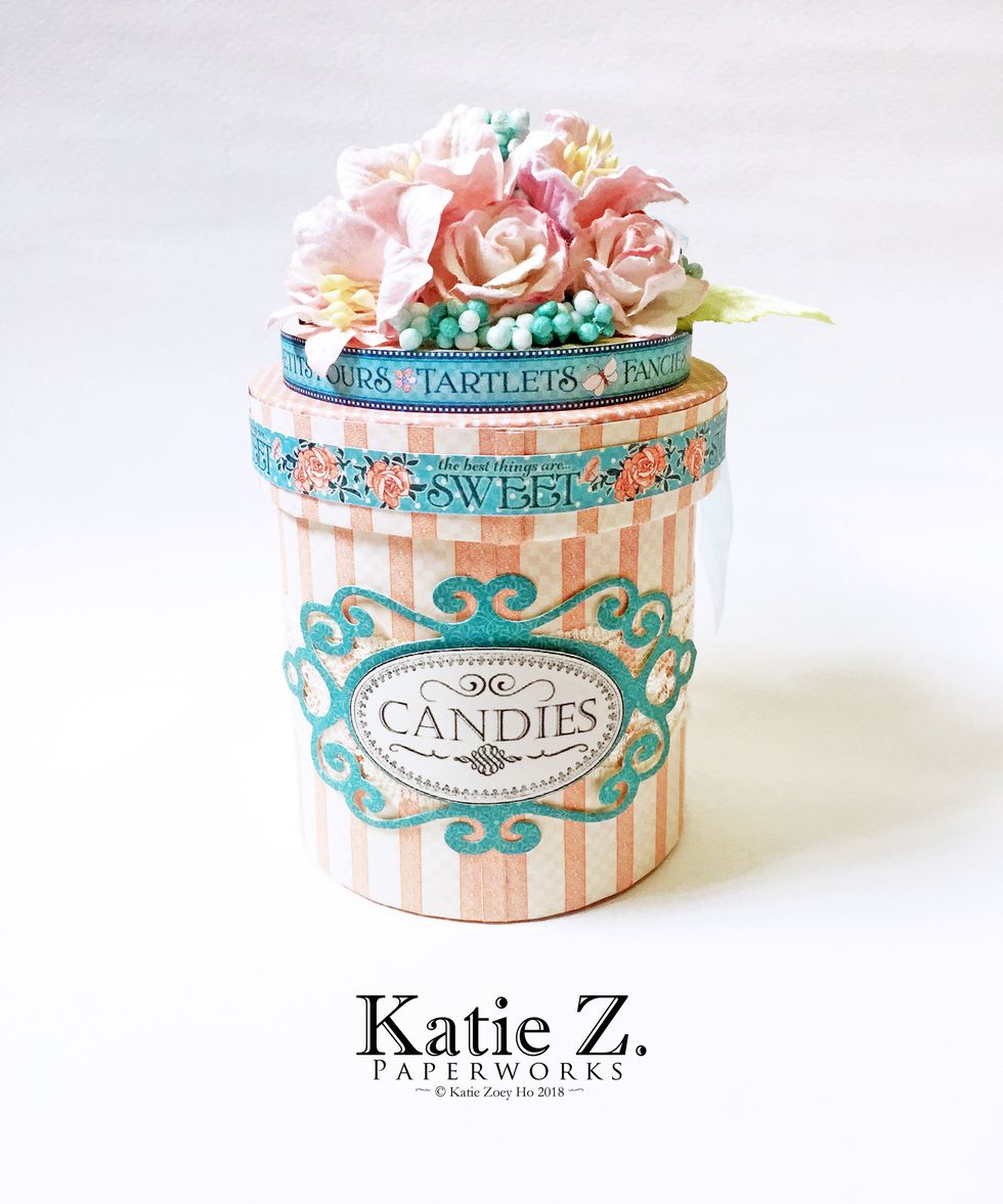 The finished embellished paper jar using some mulberry flowers on the top of the lid. The "Candies" label is created by me and is available free to download here: goo.gl/HFp6W9