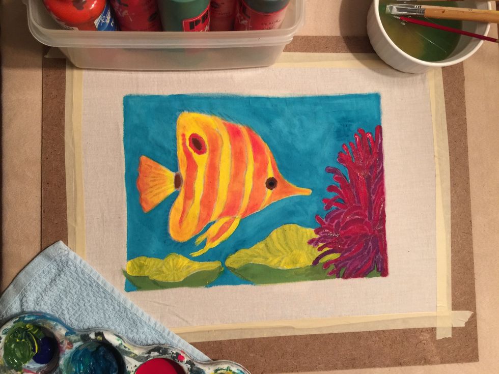 The finished painting should look something like this, with no fabric left showing. Let the paint fully dry (I like to let it dry and stain the fabric overnight).