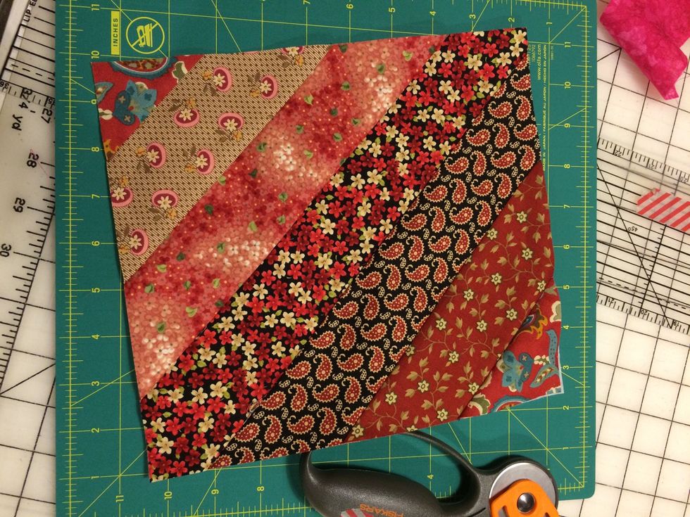The finished strip block. Make as many squares as you can with your scraps. We will gather all of these at the end of quarter and put together a quilt top.