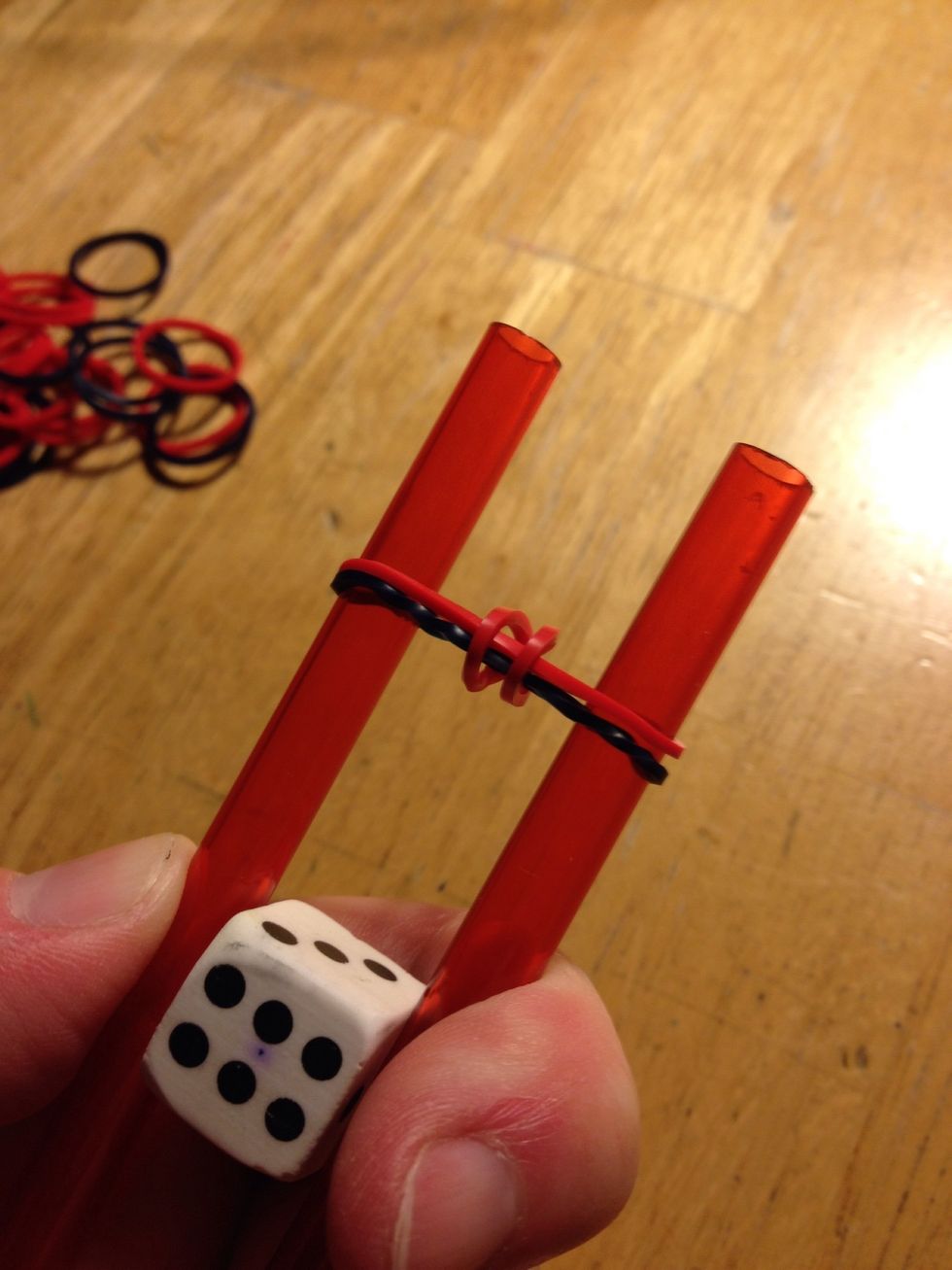 The first elastic is now loose between the other two added second and third.