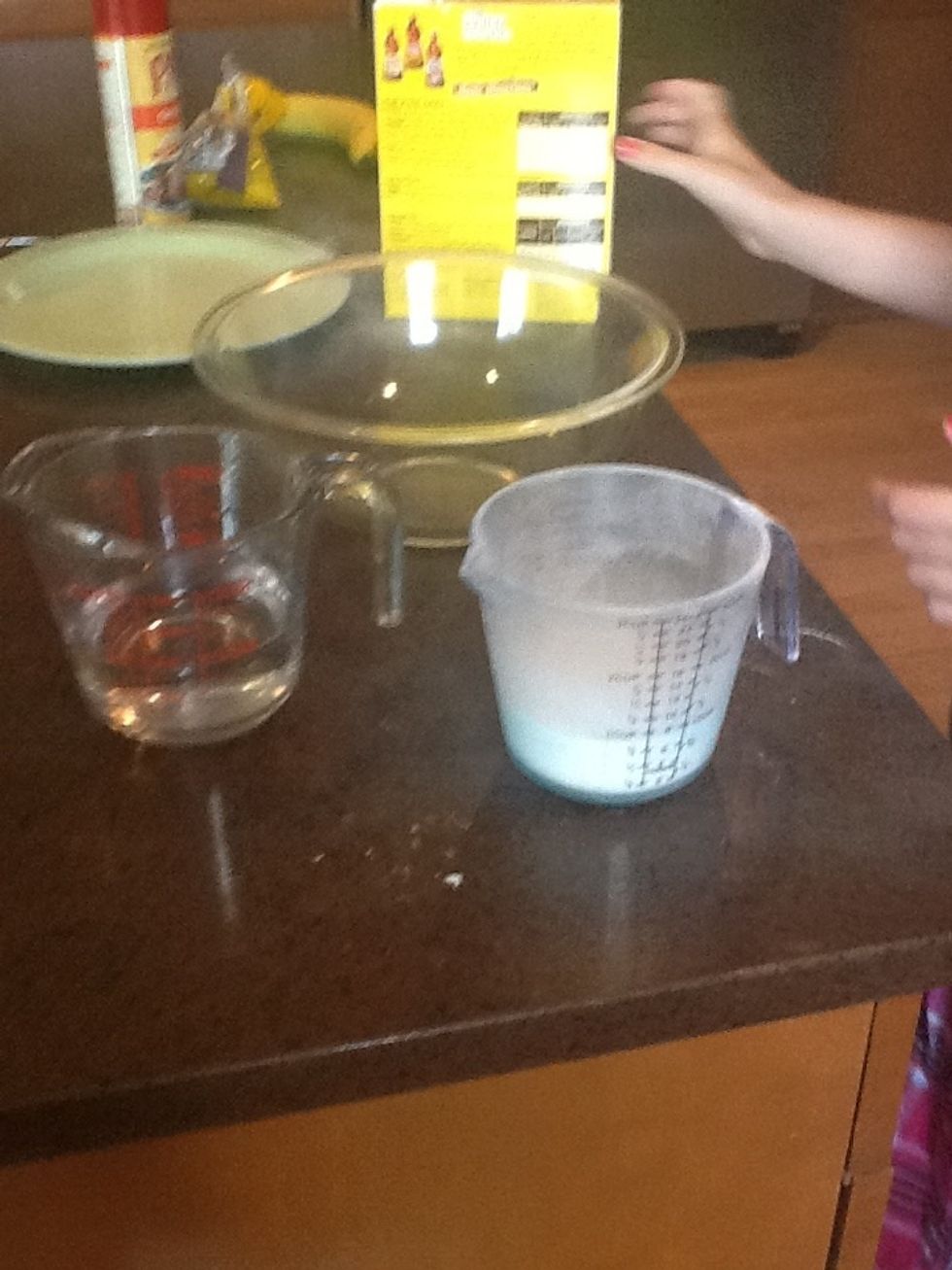 The first step is to get 3/4 a cup and water and 1 cup a pancake mix