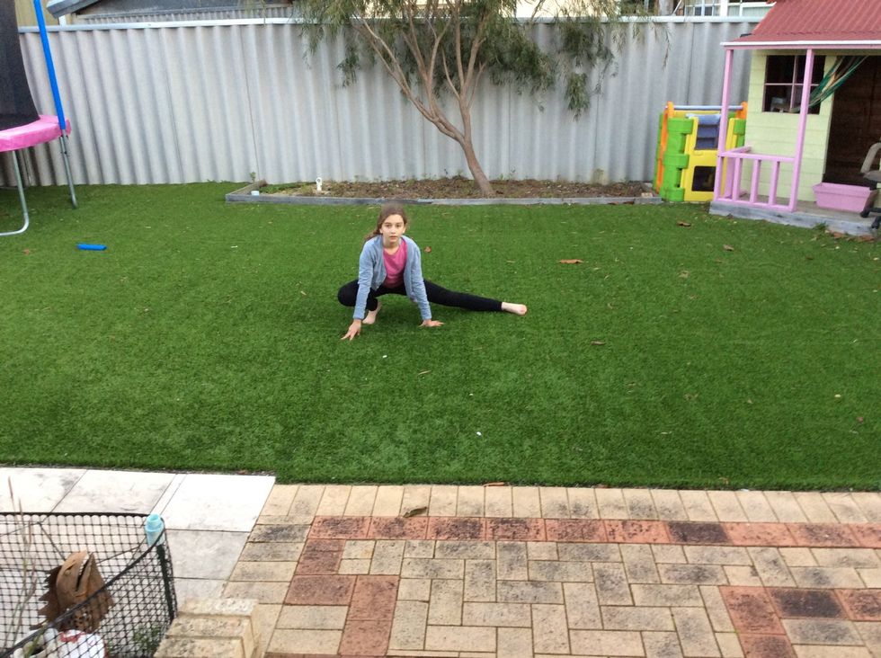 The first thing to do is make sure you are stretched. If you aren't stretched and you try this you might hurt yourself.