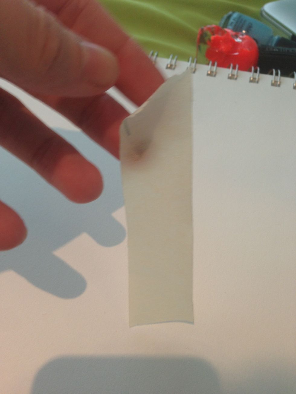 The first thing you are going to do is cut off a piece of tape. The length doesn't matter.