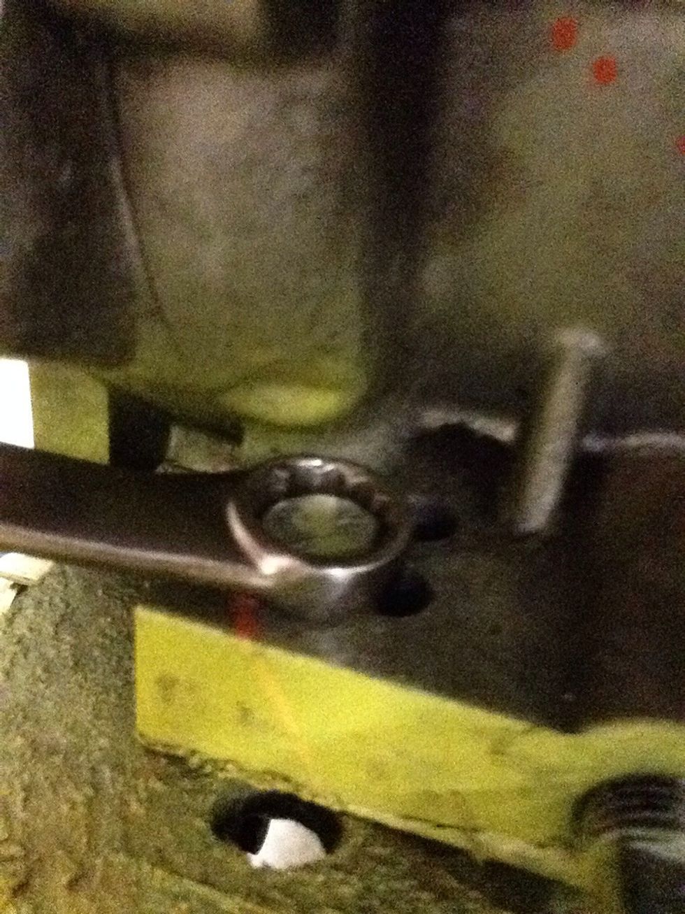 The first thing you need to do is loosen the four bolts (or how ever many other engines may have). Loosen them enough so you can wiggle around the engine.