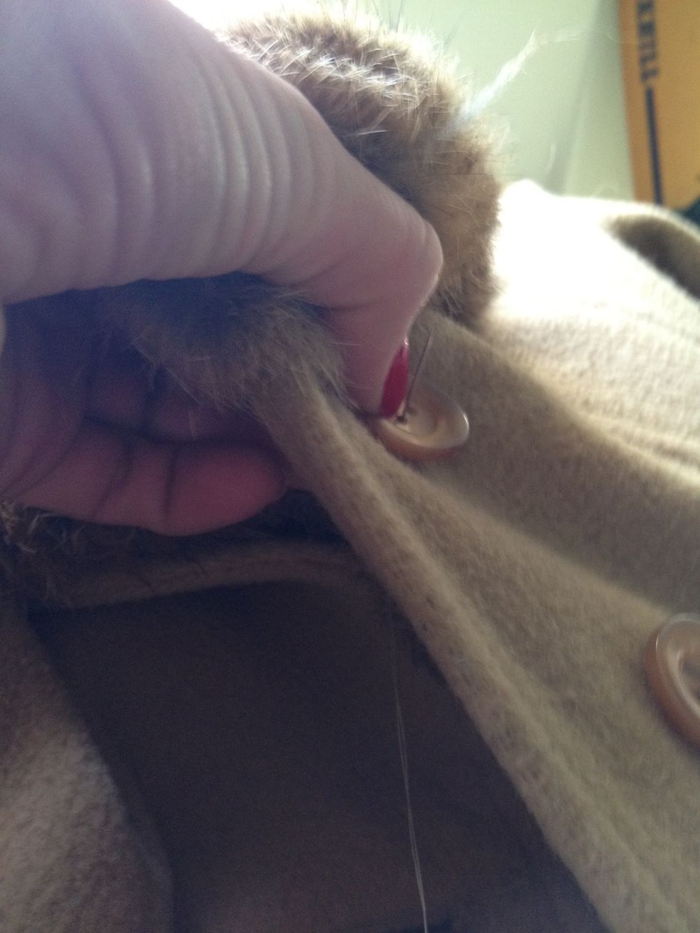 The first threading should start on the inside of the garment, so your knot is hidden and not on the visible side of the button. Come through one button hole.