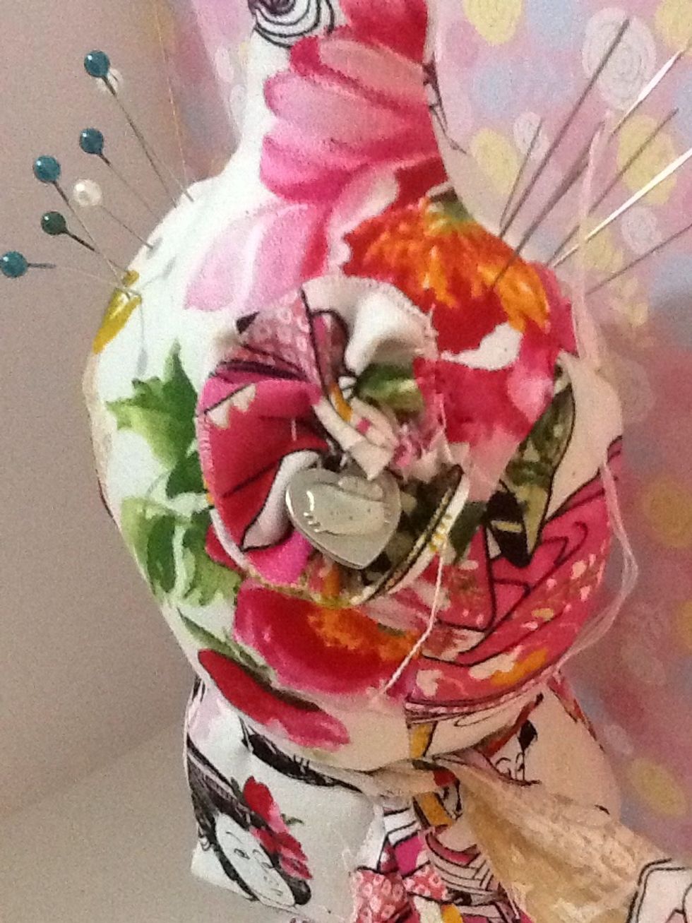 The flower is just fabric stitched in an accordion way, and I added a little metal charm to the middle.