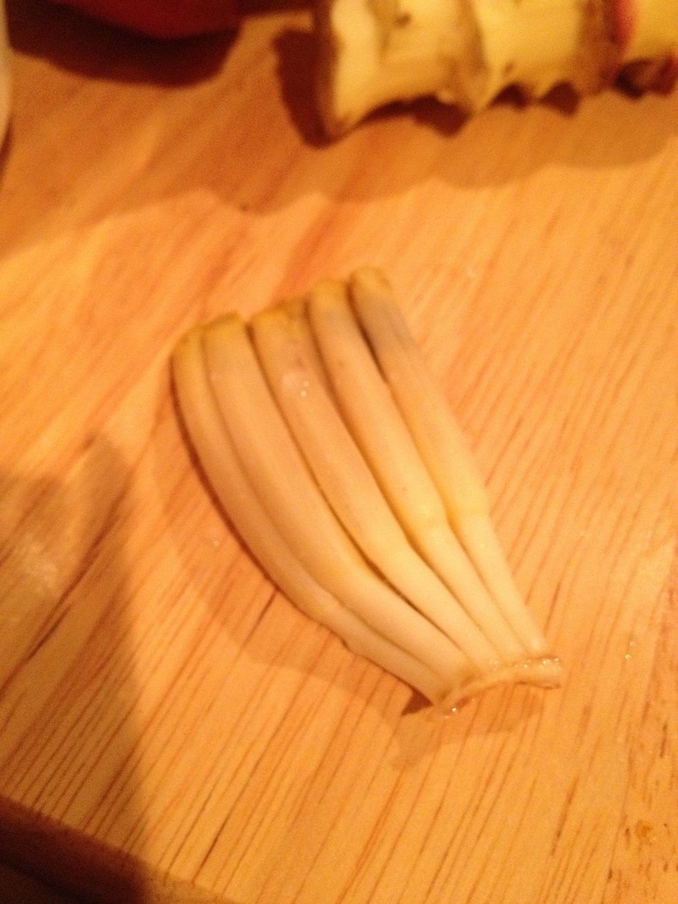 The flowers closer to the heart will get smaller and smaller and will get  harder and harder to clean. When you can't clean anymore, just separate the flowers.