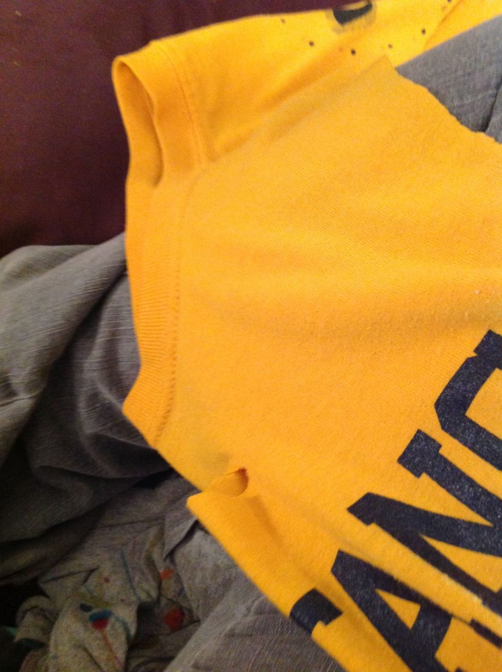 The fold it back in half again but so that the sliver is even on both sides of the shirt