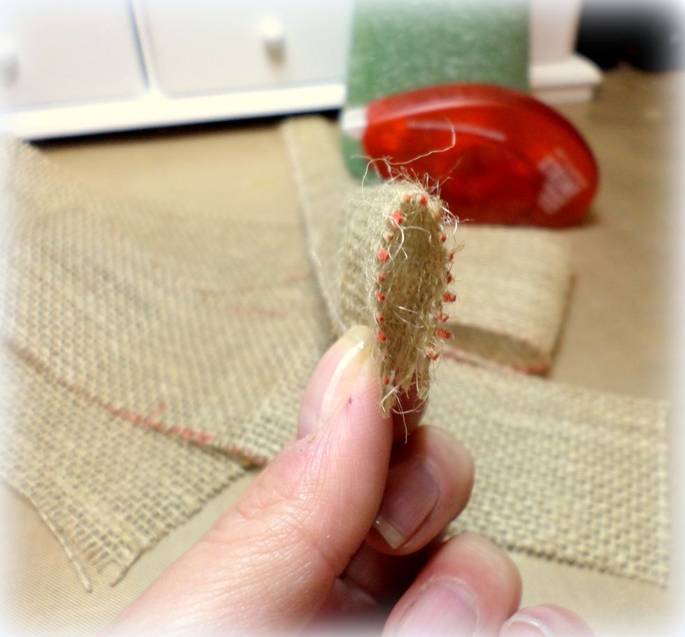 The folded strip has a glued side and a loop side.