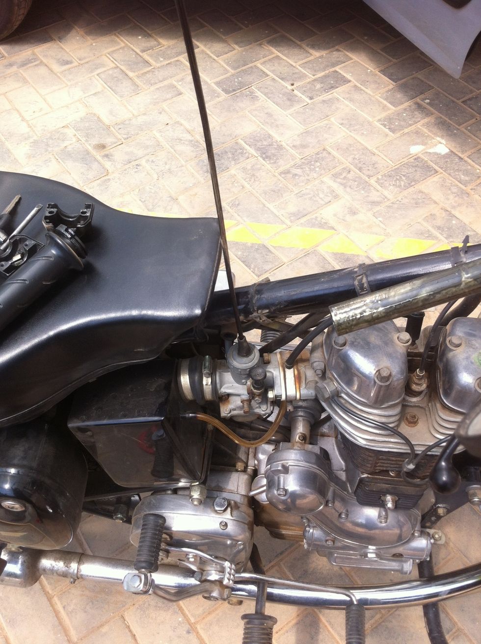 The freed cable will now be held only at the carburetor head.