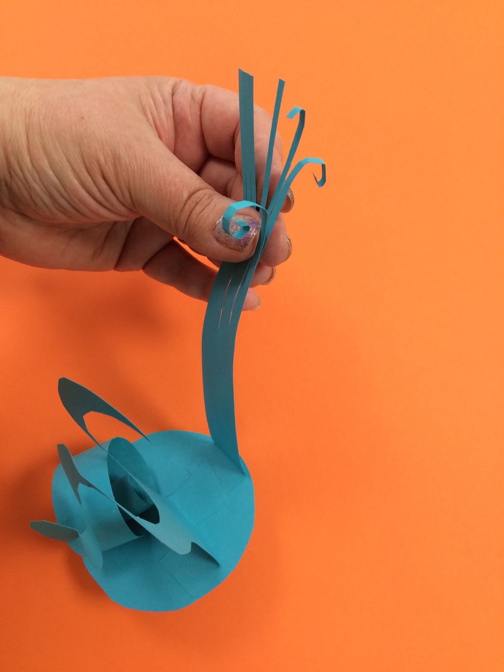 The fringe can be manipulated. Here is an example of spirals on the ends of the fringe.