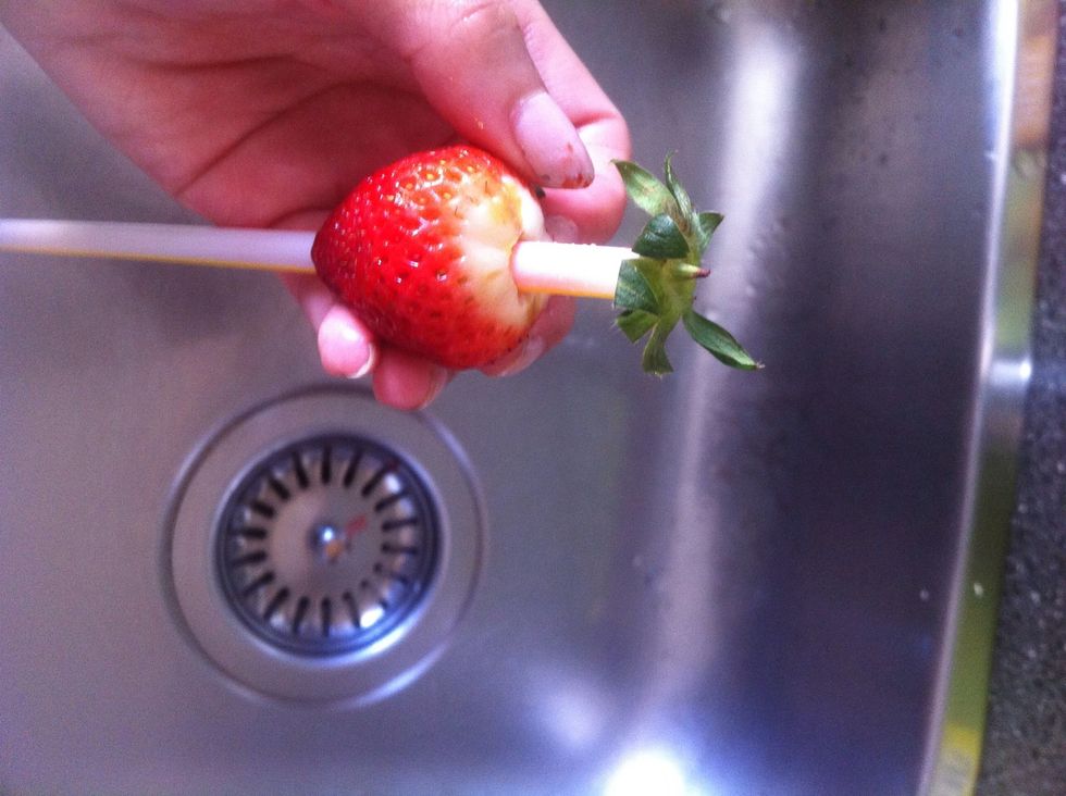 The fun part! \ud83d\ude04 Take a straw and push it from the bottom of the strawberry and push it up till it get the strawberry straw.. \ud83d\ude33