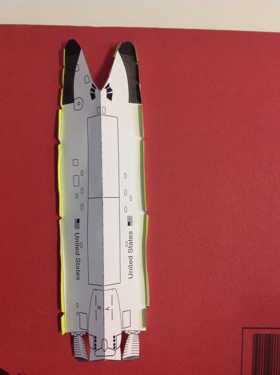 The fuselage should now look like this, with the top tabs folded in as labelled.