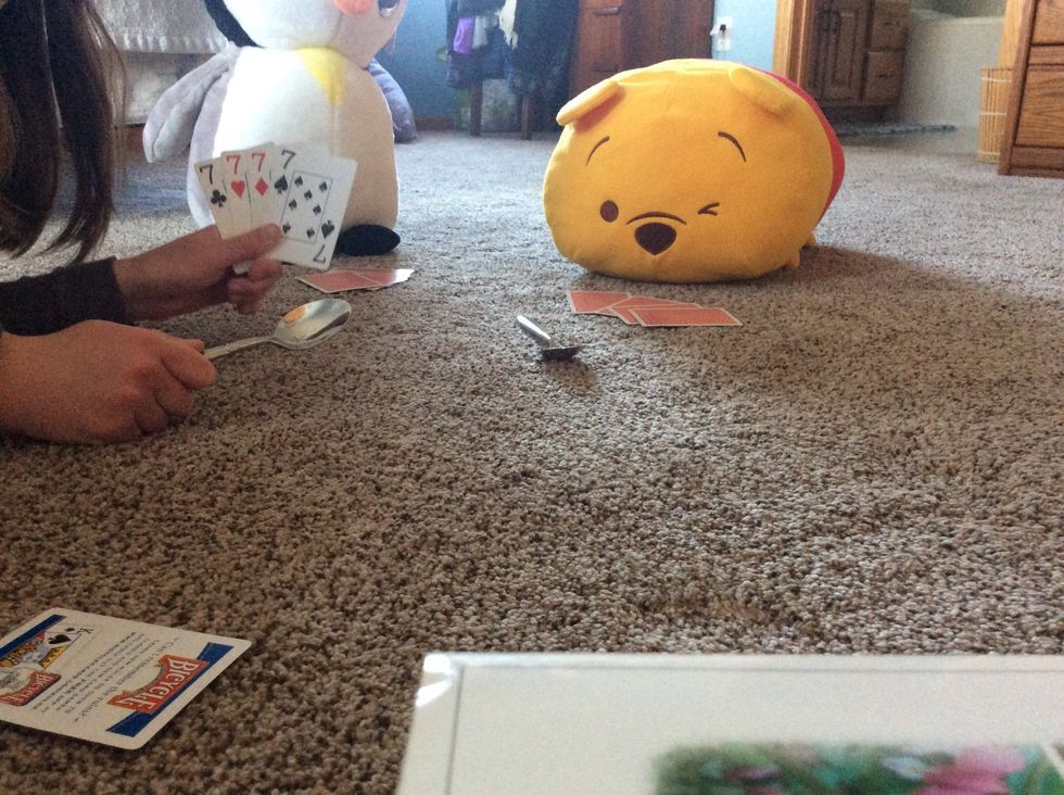 The game continues until someone gets 4 of the same cards and they steal a spoon and hide it, then they keep playing as if nothing happened.