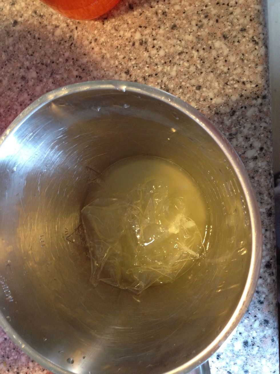 The gelatine + some of the lemon juice. Place your metal  bowl in another bowl with the hot water.
