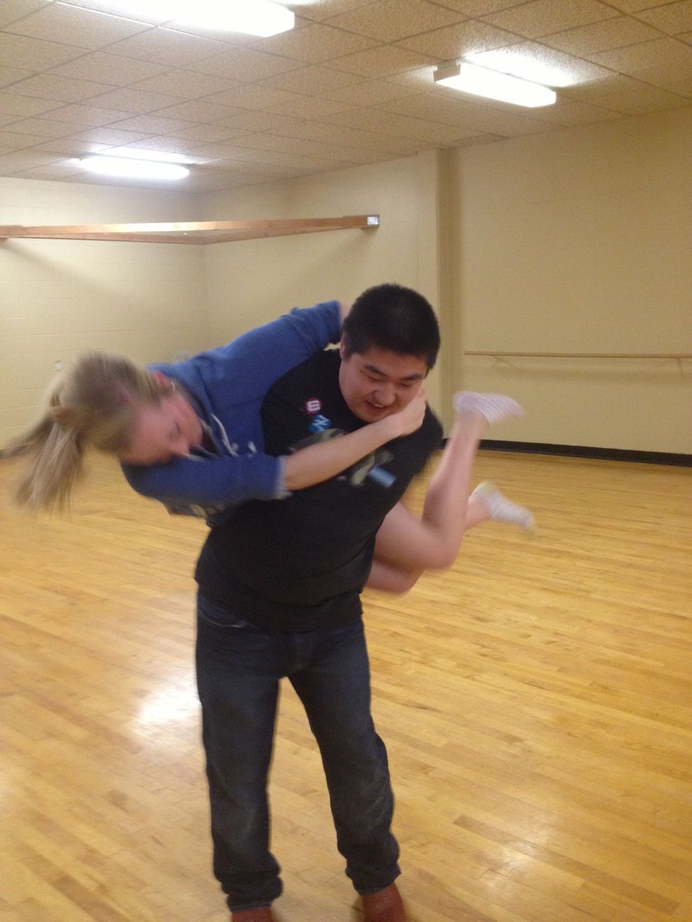 The girl should clench her legs around your arm. Really helps to prevent from dropping. And then head is going to come around. Turning in a circle help get her around.