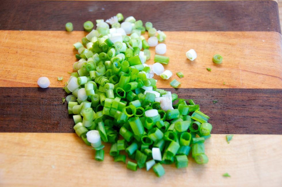 The green onion is the final garnish for this dish.  Dice the green onion completely, including the green stem...
