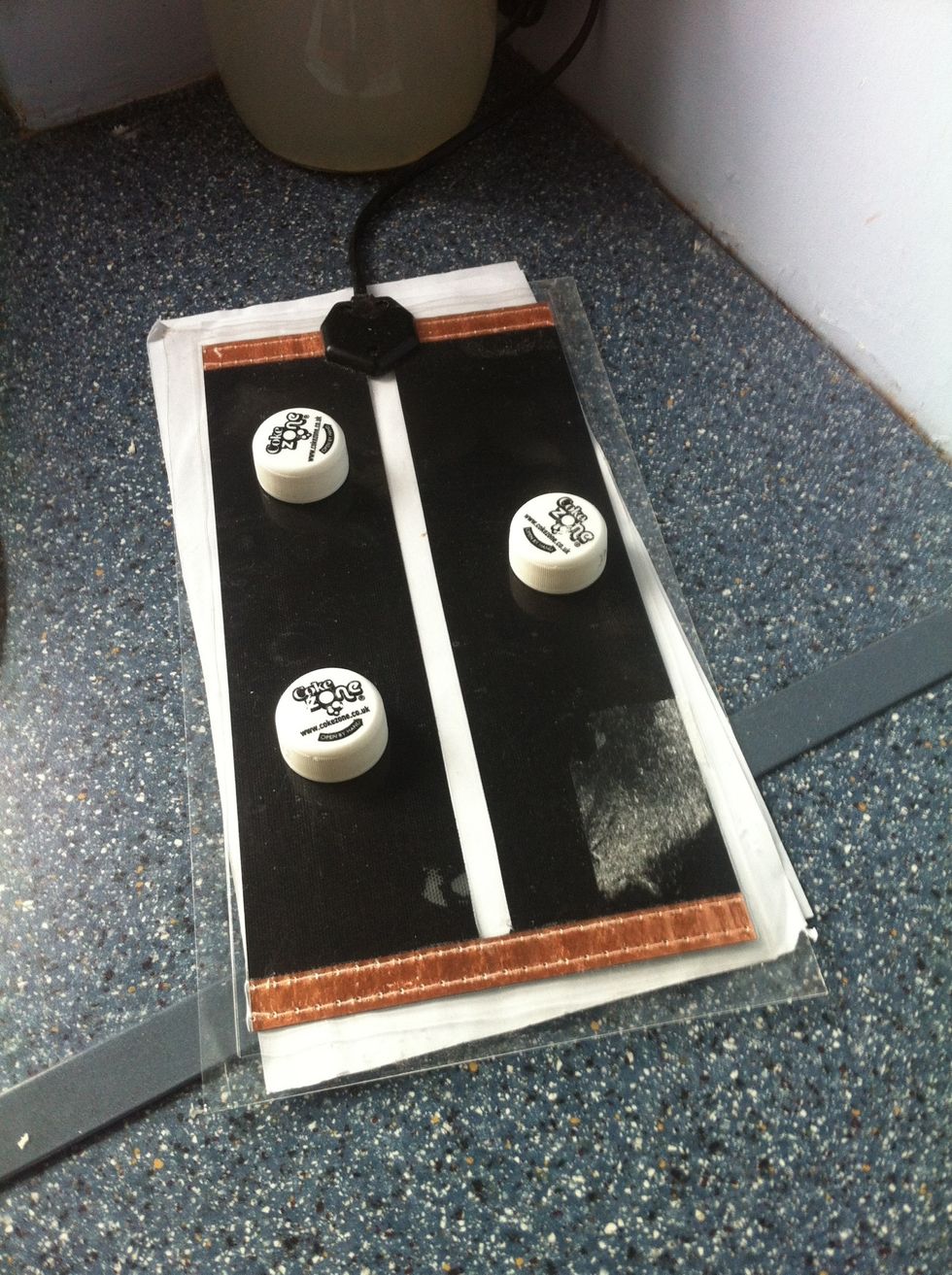 The Heat Mat - use old plastic bottle tops to lift the bowl away from the heat and a couple of sheets of paper to protect the work top.