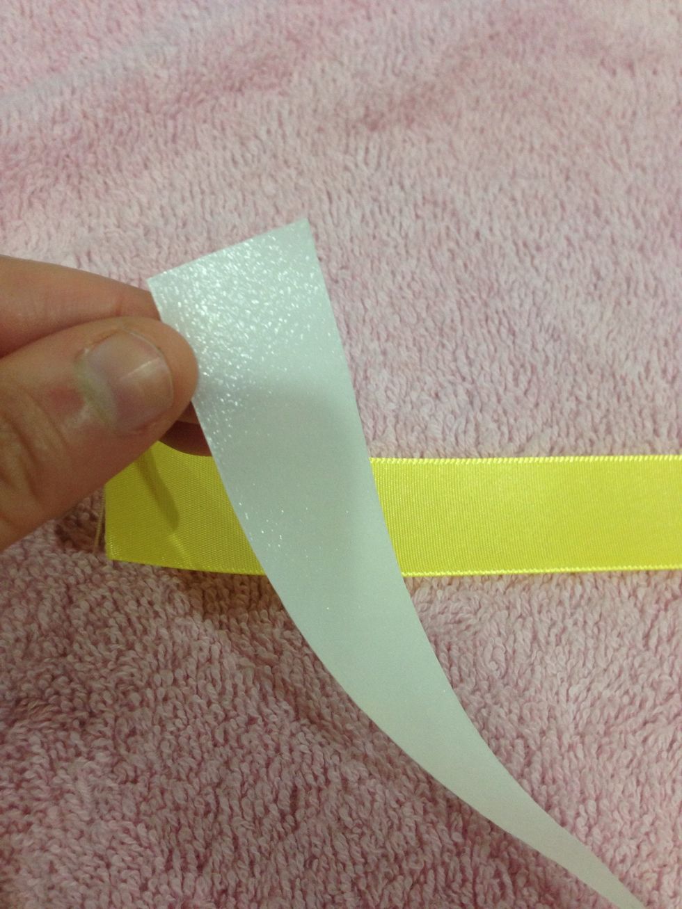 The heat n bond has two sides. Make sure to put the rough looking side facing the inside if the ribbon. Line up the ribbon & the heat n bond & when you are ready press the iron for 2 seconds on them.