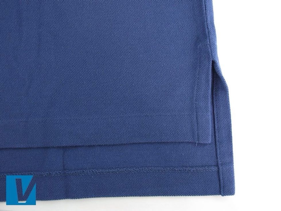 The hem of a Polo by Ralph Lauren polo shirt should be straight, evenly and neatly stitched, with the back slightly longer than the front.