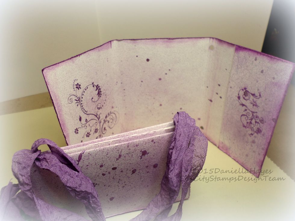 The holes in the cover are in the spine closest to the pocket. And all 3 signatures have seambinding. You are ready to make your art journal!!