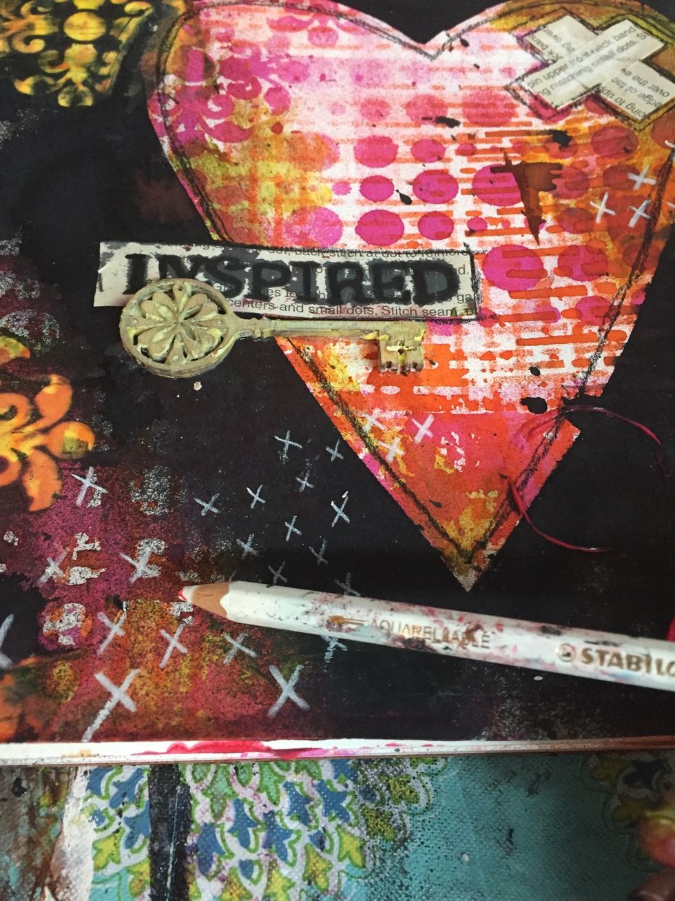 The I used a white Stabilo to add some designs to page.