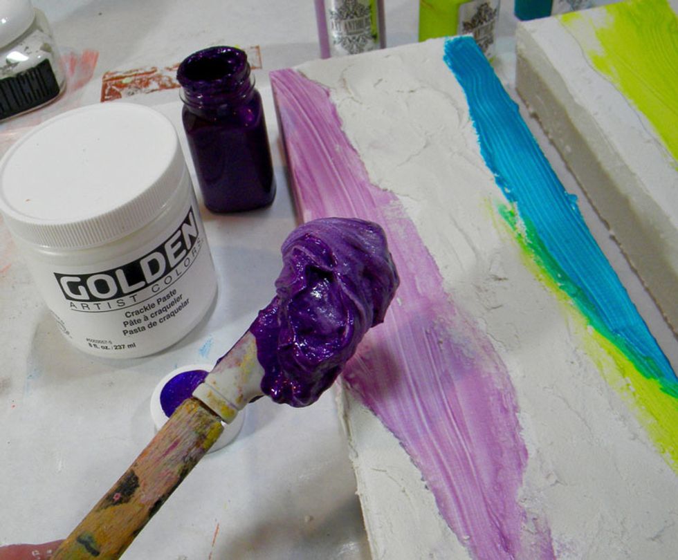 The idea is to layer crackle paste over the Velvet colors.  Mix Fluorite Gemstones with Golden Crackle Paste and lay it down in a thick layer on top of the Orchid on all three canvases.