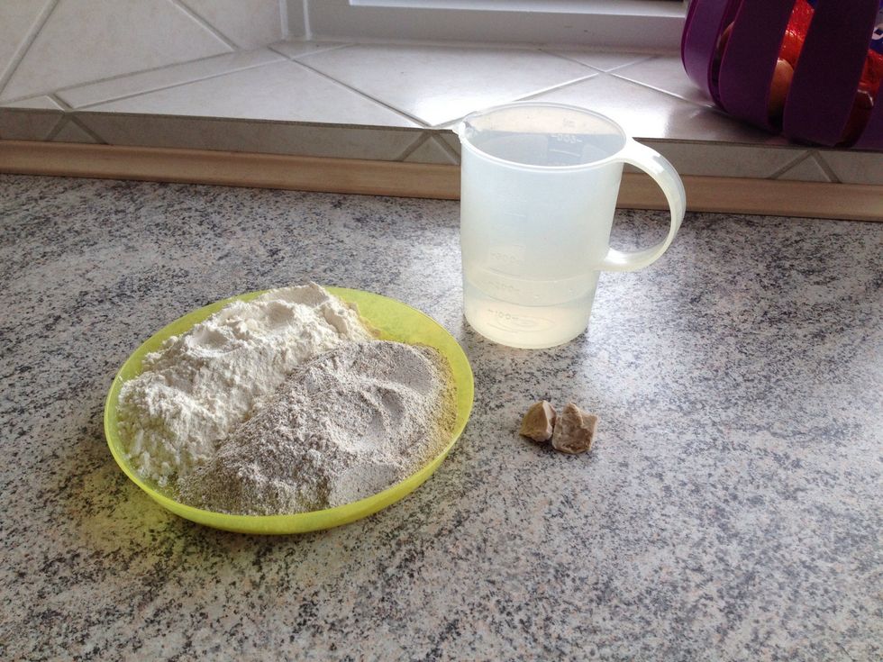 The ingredients needed to make the first part of the dough: yeast, water, flour