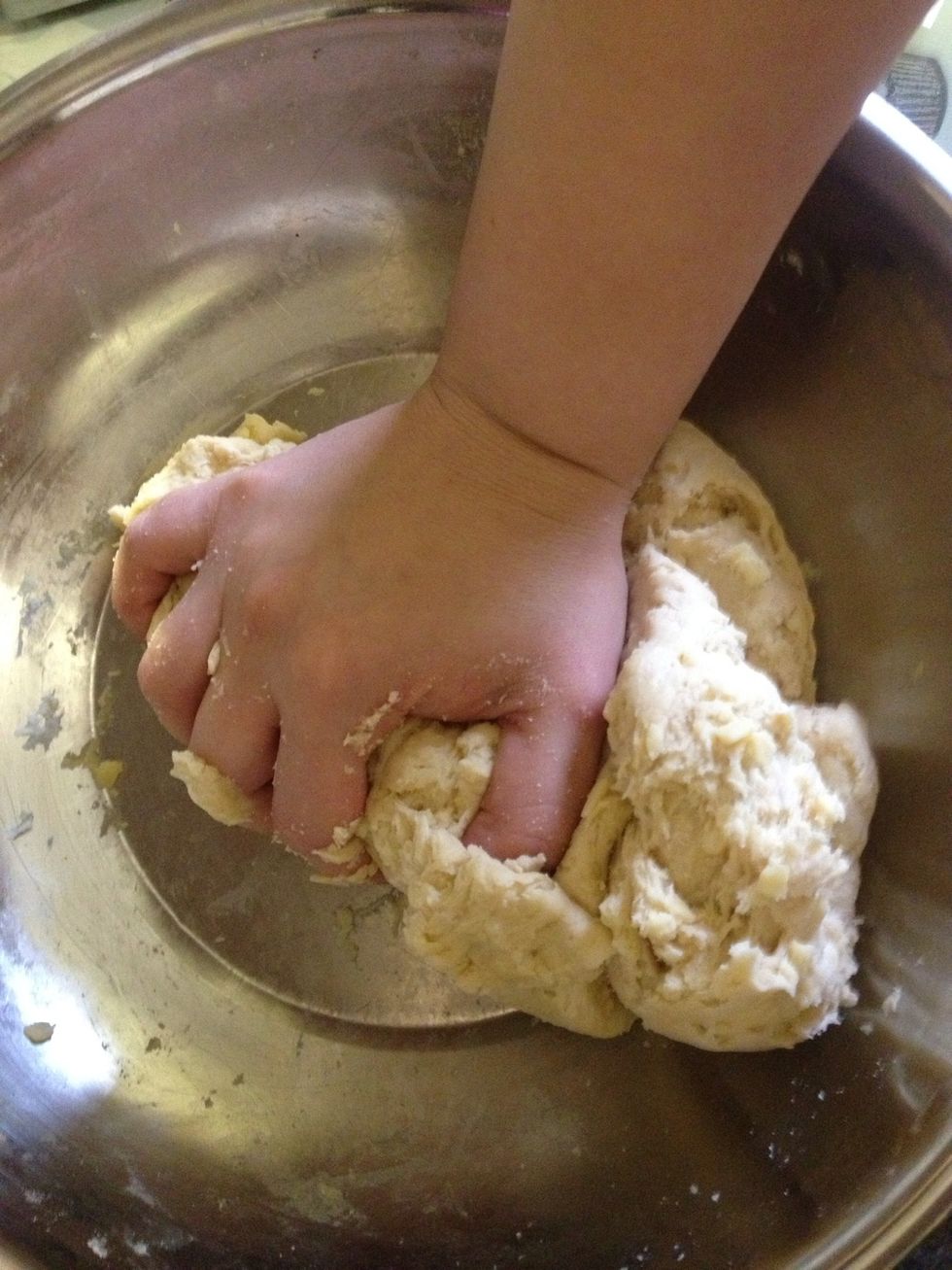 The ingredients should mix well and create a dough. If it's too dry, add some more sour cream. If it's too sticky and soft, add flour.
