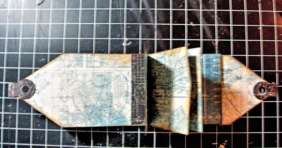 The inner pages are now secured to the cover, and we can begin to decorate the mini tag book.