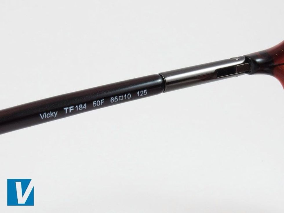 The inside of the left arm of Tom Ford sunglasses feature the model name, model number beginning TF..., followed by colour code and lens and frame sizes.