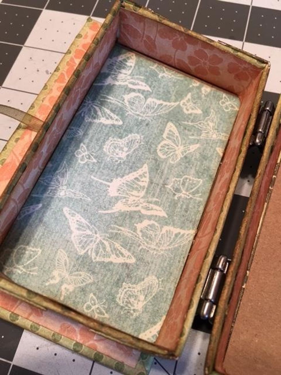 The inside of the left box section should look like this.  The right section should have paper on the sides only as you still need to create and attach the fold out album pages.