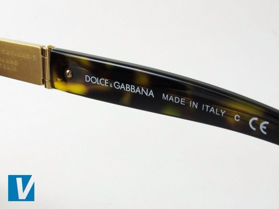 The inside right temple arm of D&G sunglasses feature the D&G name, followed by Made in Italy and the letters CE representing European Conformity. Check for any errors in spacing or alignment.