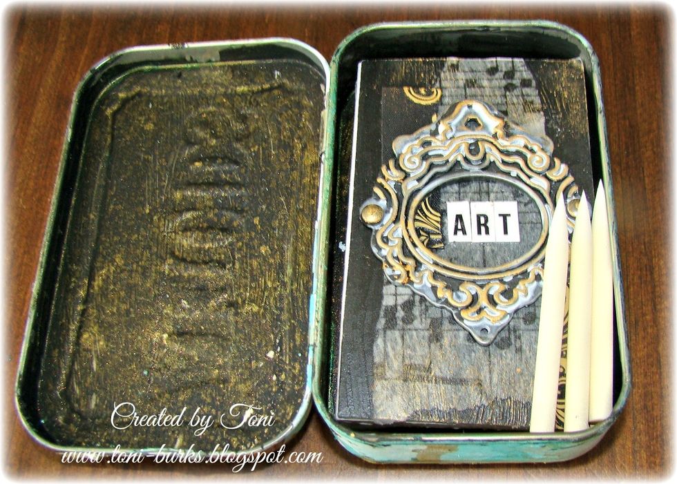 The inside was prepped with black gesso and Metal Effects Gold was spritzed. The tin now holds all your little canvases perfectly as well as you have room for pen nibs or little brushes needed.