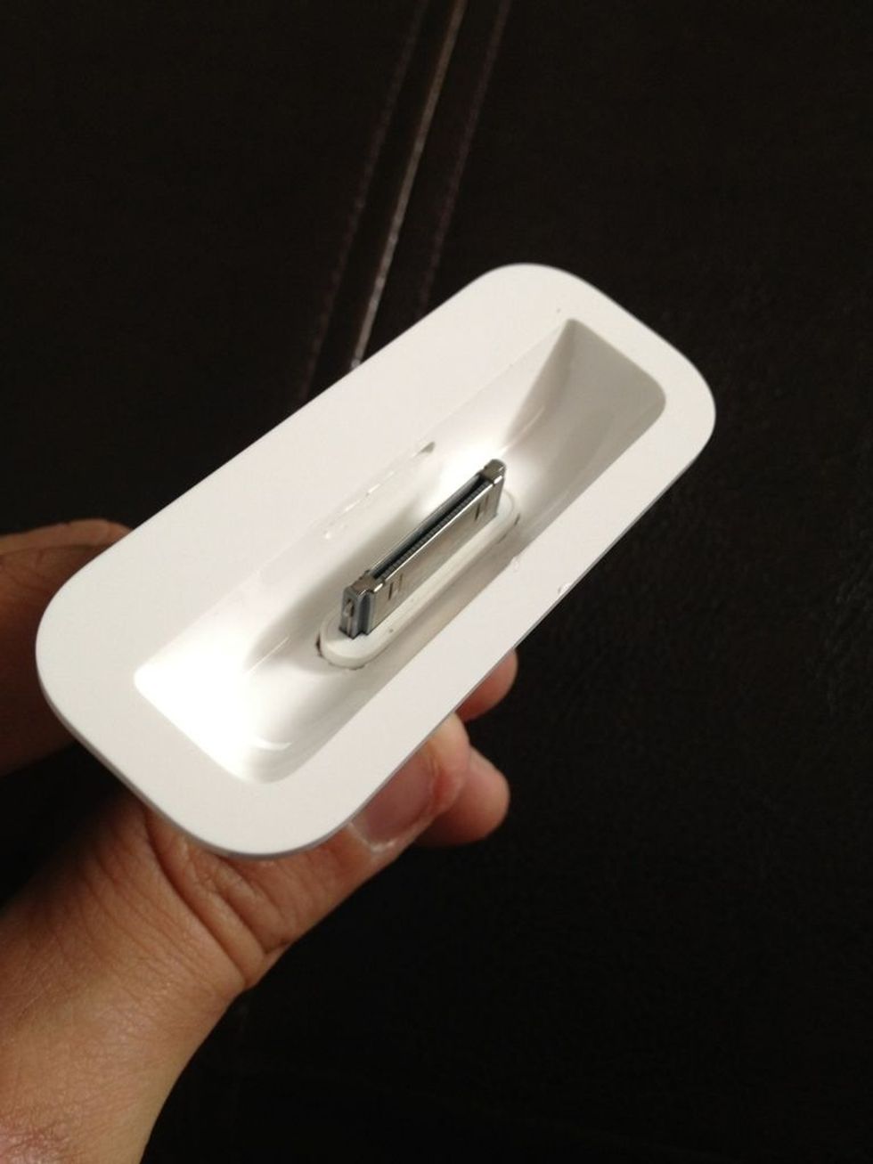 The iPhone connector doesn't actually fit into the Apple dock adapter, so take a razor, scissors, whatever, and slightly trim the ends, the width is fine just make the slot a tad longer.