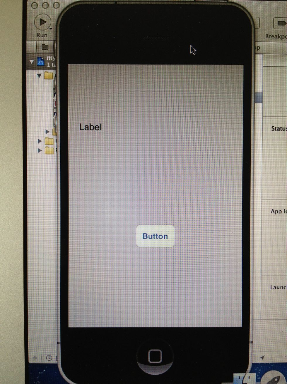 The iPhone Simulator looks like this... You can see the Interface we build in the Interface Builder before... Now lets give the Button an action, to get our very first "Hello World" App done.